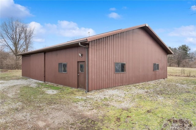 view of side of property with an outbuilding