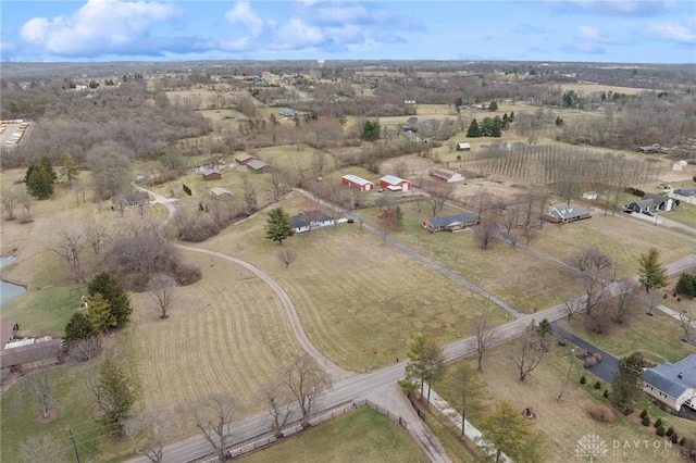 birds eye view of property featuring a rural view