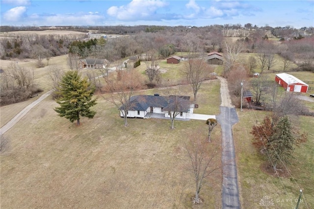 birds eye view of property with a rural view