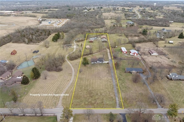 birds eye view of property with a rural view