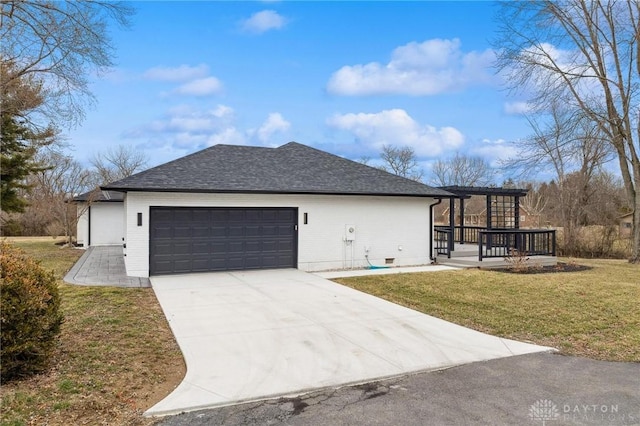 view of property exterior with roof with shingles, a lawn, a pergola, a garage, and driveway