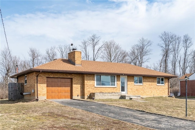 single story home featuring a garage, brick siding, driveway, and a chimney