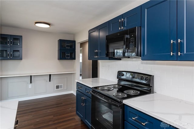 kitchen with blue cabinets, visible vents, dark wood-style floors, black appliances, and glass insert cabinets