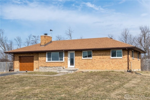 view of front facade featuring driveway, an attached garage, a chimney, and fence