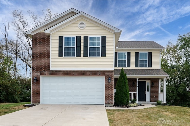 view of front of house with a garage, driveway, brick siding, and a front lawn