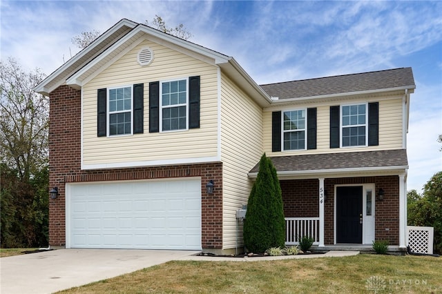 view of front of house with a porch, concrete driveway, brick siding, and a garage