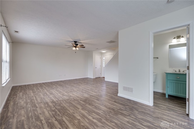 spare room with visible vents and wood finished floors