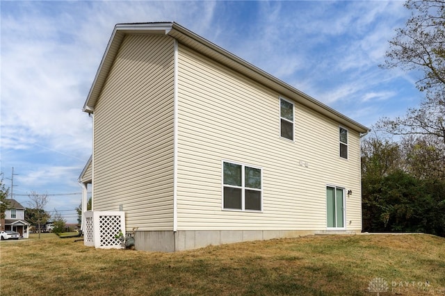 view of property exterior featuring a yard