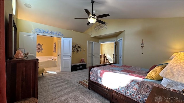 bedroom featuring lofted ceiling, ceiling fan, carpet flooring, and ensuite bathroom