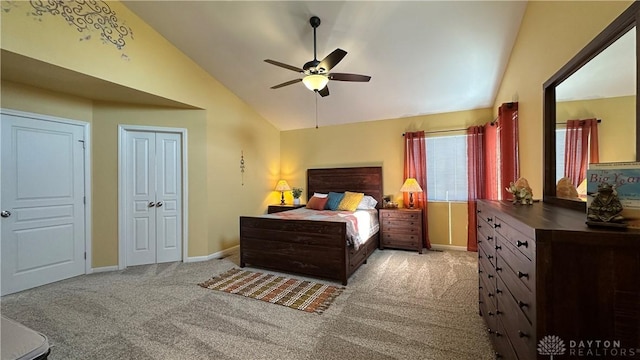 carpeted bedroom featuring lofted ceiling, ceiling fan, and baseboards