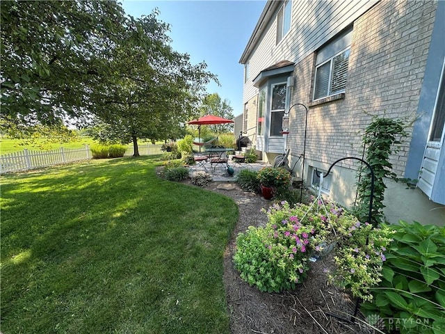 view of yard featuring a patio area and fence