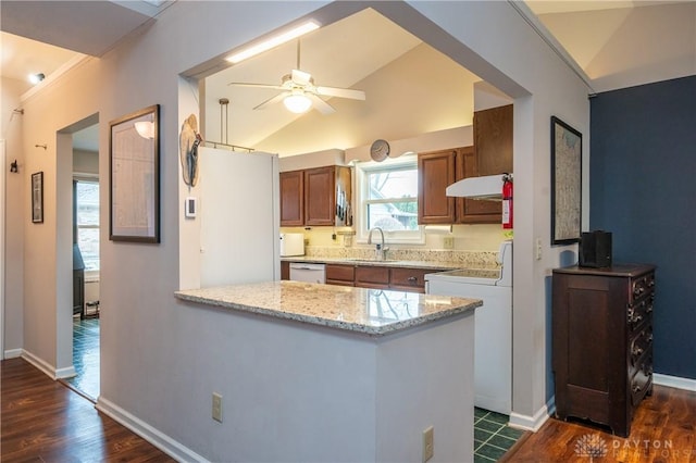 kitchen featuring dark wood-type flooring, a sink, a peninsula, and dishwasher