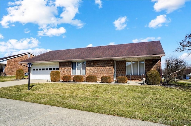 single story home featuring an attached garage, concrete driveway, brick siding, and a front yard