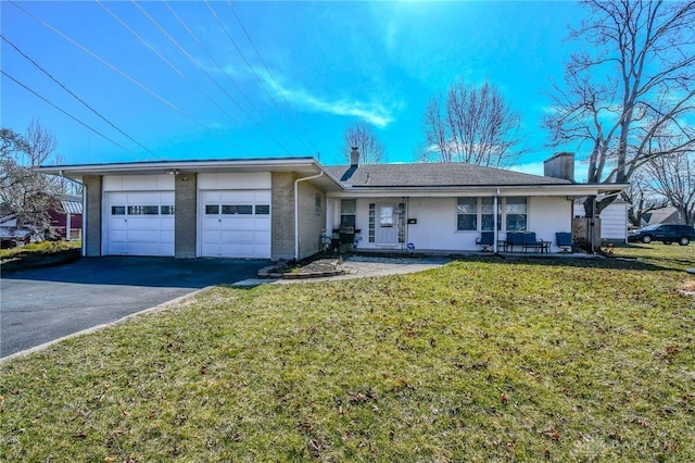 120 Overlook St, Englewood, OH 45322 - ranch-style house featuring an attached garage, brick siding, a front yard, a chimney, and driveway
