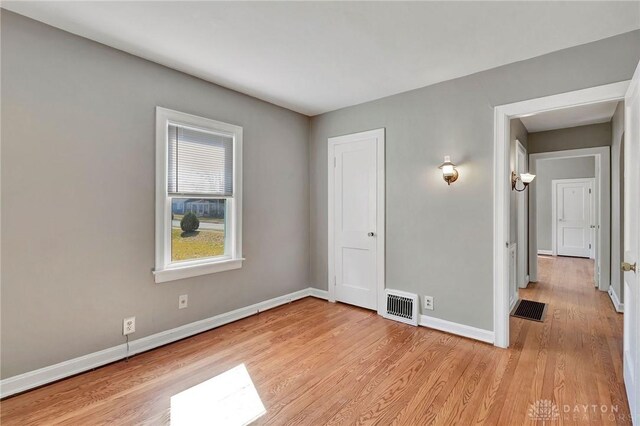 543 W Market St, Germantown, OH 45327 - unfurnished bedroom featuring light wood-style flooring and baseboards