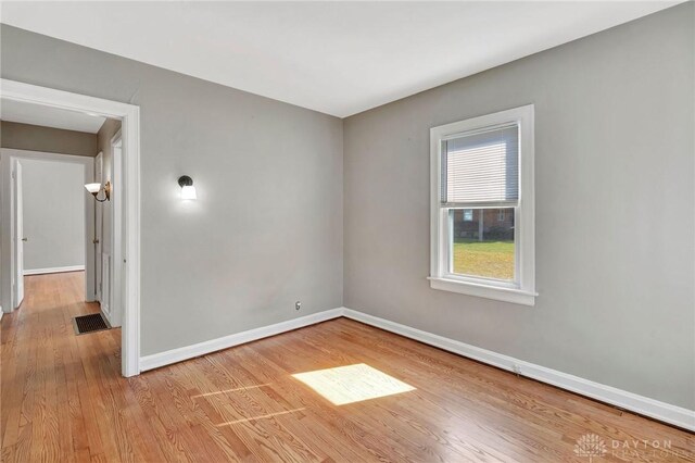 543 W Market St, Germantown, OH 45327 - unfurnished room featuring wood finished floors and baseboards