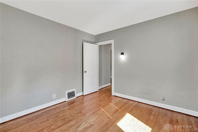 543 W Market St, Germantown, OH 45327 - spare room with baseboards and wood finished floors