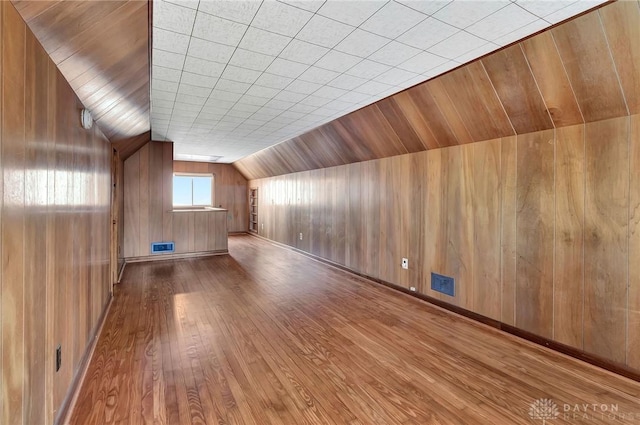 543 W Market St, Germantown, OH 45327 - additional living space featuring hardwood / wood-style floors, wooden walls, and vaulted ceiling