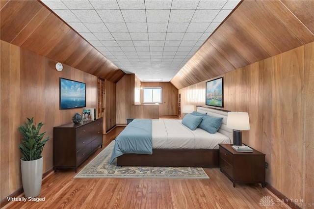 543 W Market St, Germantown, OH 45327 - bedroom with wooden walls, vaulted ceiling, and wood finished floors