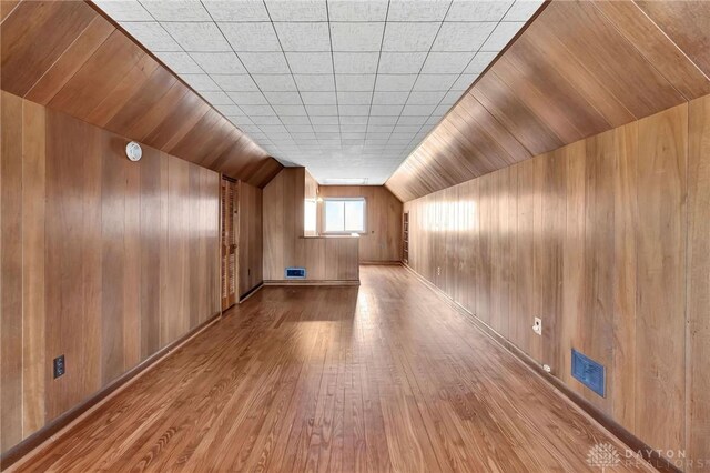 543 W Market St, Germantown, OH 45327 - bonus room featuring wood finished floors, wooden walls, and lofted ceiling