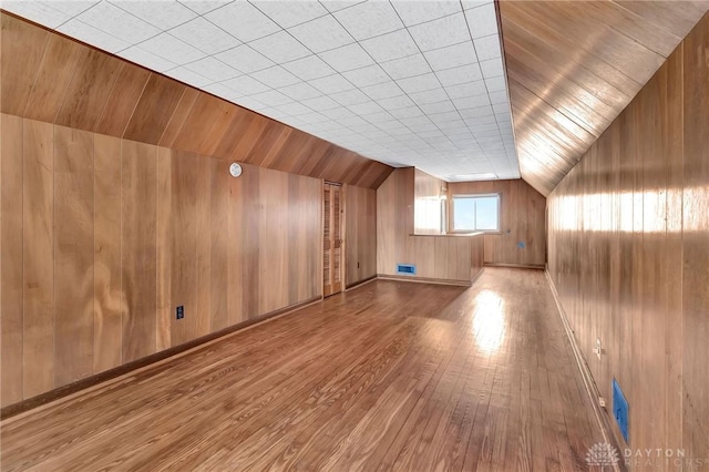 543 W Market St, Germantown, OH 45327 - additional living space featuring wood finished floors, lofted ceiling, and wooden walls