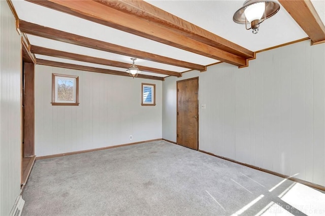 543 W Market St, Germantown, OH 45327 - carpeted spare room featuring beam ceiling, baseboards, and wood walls