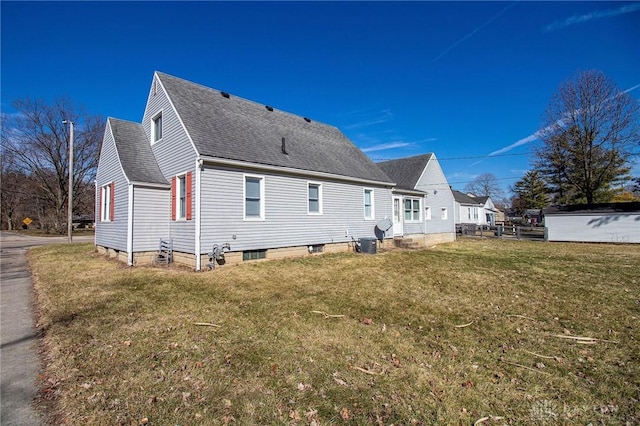 543 W Market St, Germantown, OH 45327 - back of property featuring a shingled roof, a yard, and cooling unit