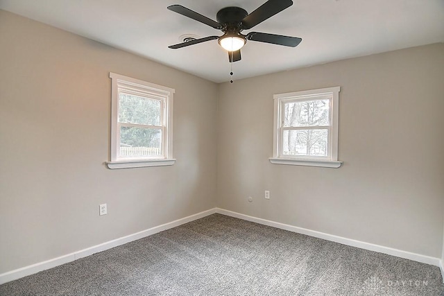 spare room with baseboards, carpet floors, and a healthy amount of sunlight