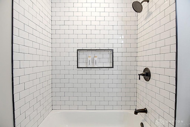 bathroom featuring washtub / shower combination