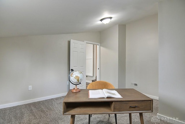 home office with carpet flooring, vaulted ceiling, and baseboards