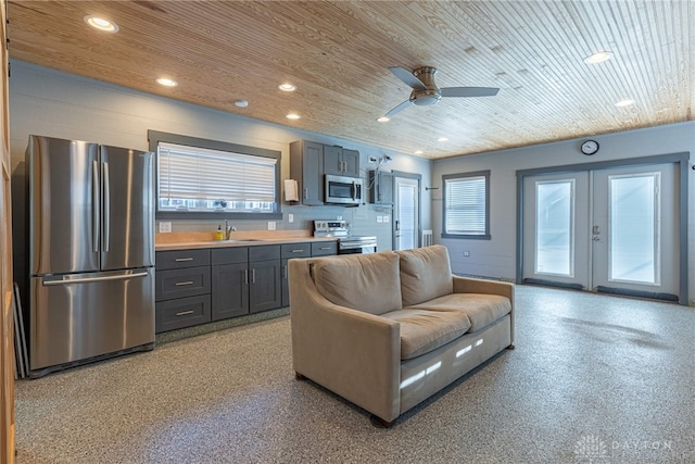 kitchen featuring recessed lighting, wood ceiling, stainless steel appliances, and french doors