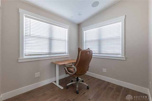 office featuring lofted ceiling, wood finished floors, and baseboards