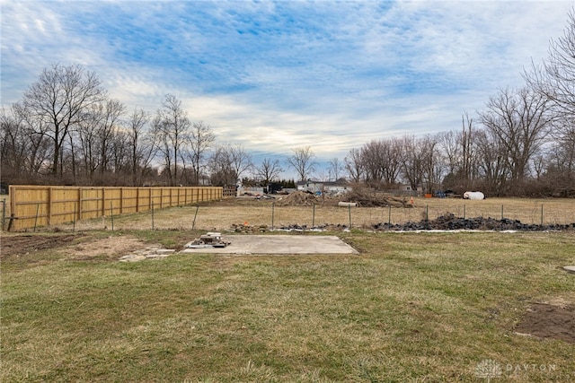 view of yard featuring a rural view and fence