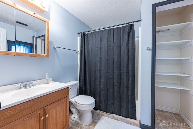 full bath with a textured ceiling, visible vents, shower / tub combo with curtain, toilet, and vanity