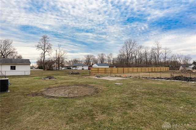 view of yard featuring fence and cooling unit