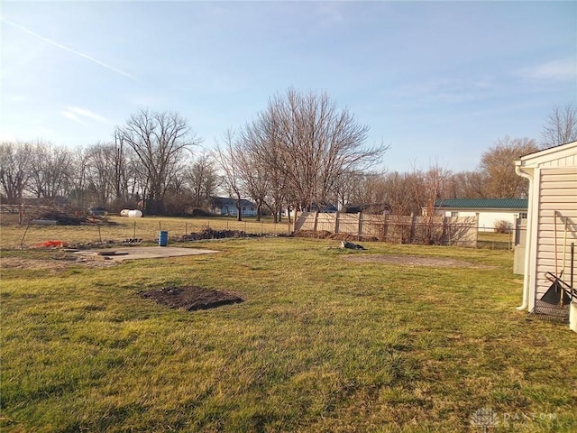 view of yard with a patio and fence