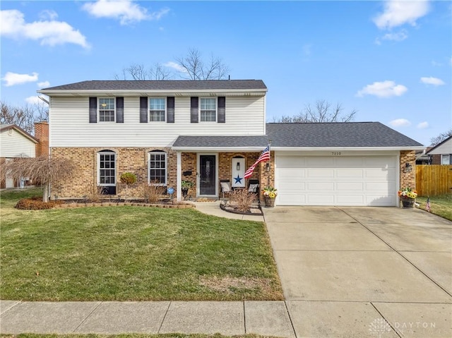 view of front of property with driveway, an attached garage, fence, a front lawn, and brick siding