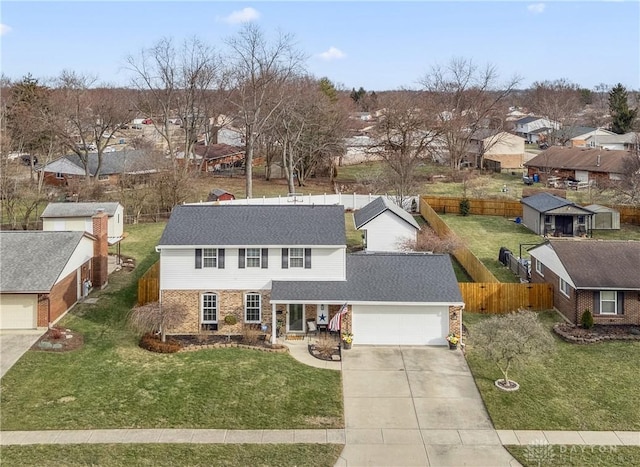 view of front of house featuring driveway, an attached garage, a residential view, and brick siding