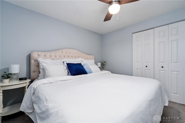 carpeted bedroom with a closet and ceiling fan