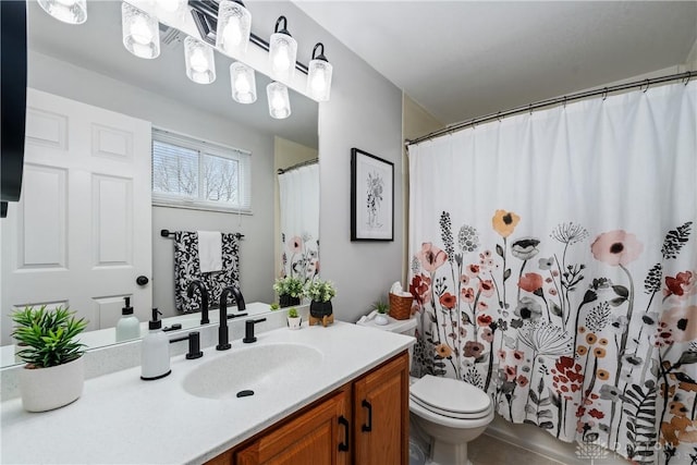 full bath featuring toilet and vanity