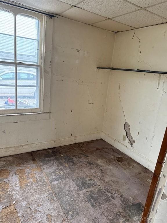 unfurnished room with a paneled ceiling