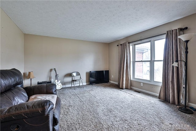 living area featuring a textured ceiling, baseboards, and carpet flooring