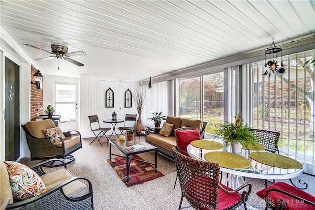 sunroom / solarium featuring a ceiling fan and a wealth of natural light