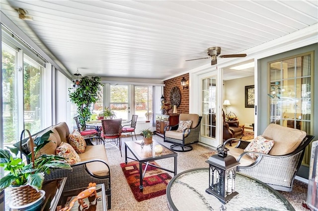 sunroom / solarium featuring ceiling fan