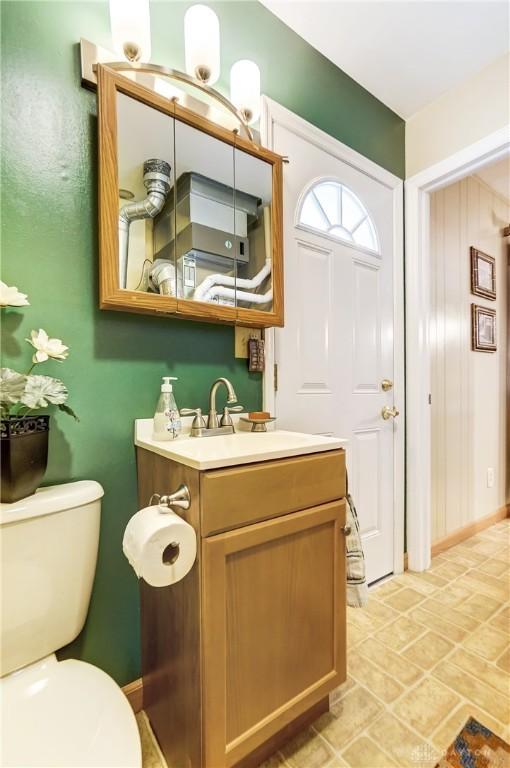 bathroom featuring toilet and vanity