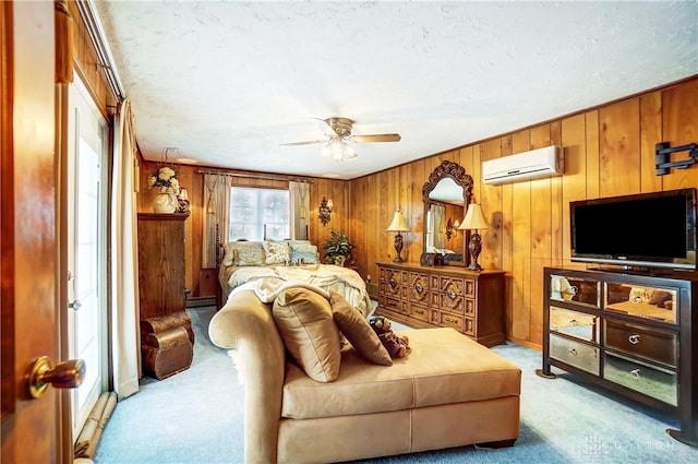 bedroom featuring a baseboard radiator, a wall unit AC, wood walls, and light carpet