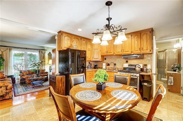 dining space with a chandelier and recessed lighting