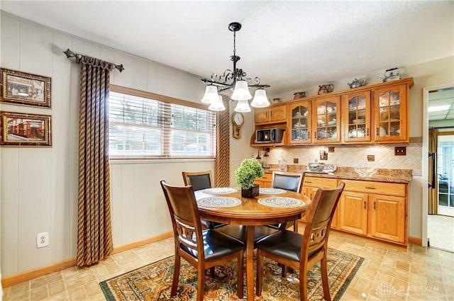 dining room with a notable chandelier