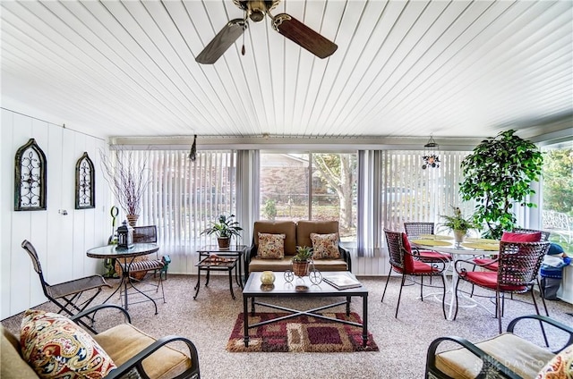 sunroom / solarium with a ceiling fan