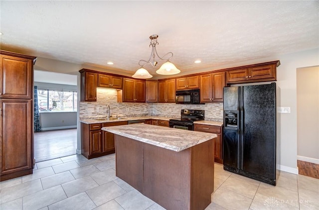 kitchen featuring decorative backsplash, a sink, black appliances, and a kitchen island